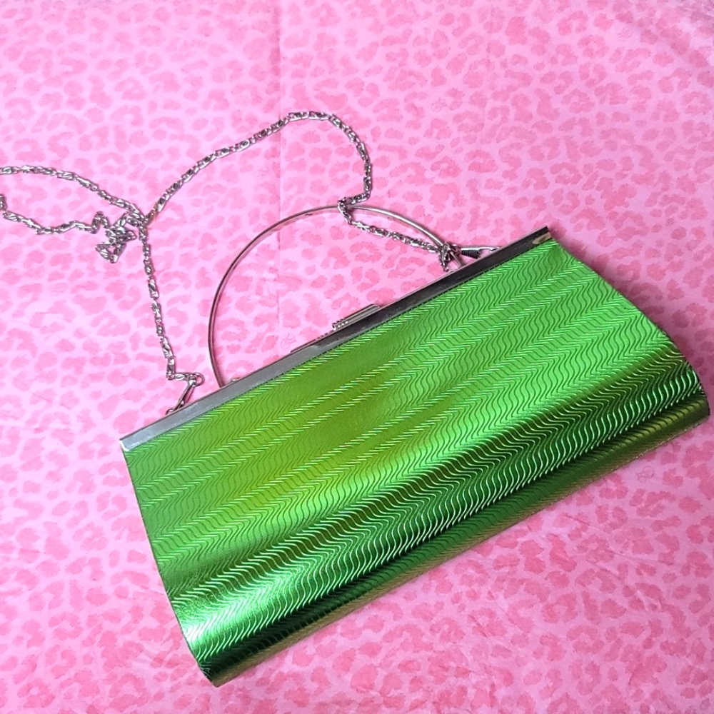Lime green metallic clutch purse with silver metal handle.  New with tag